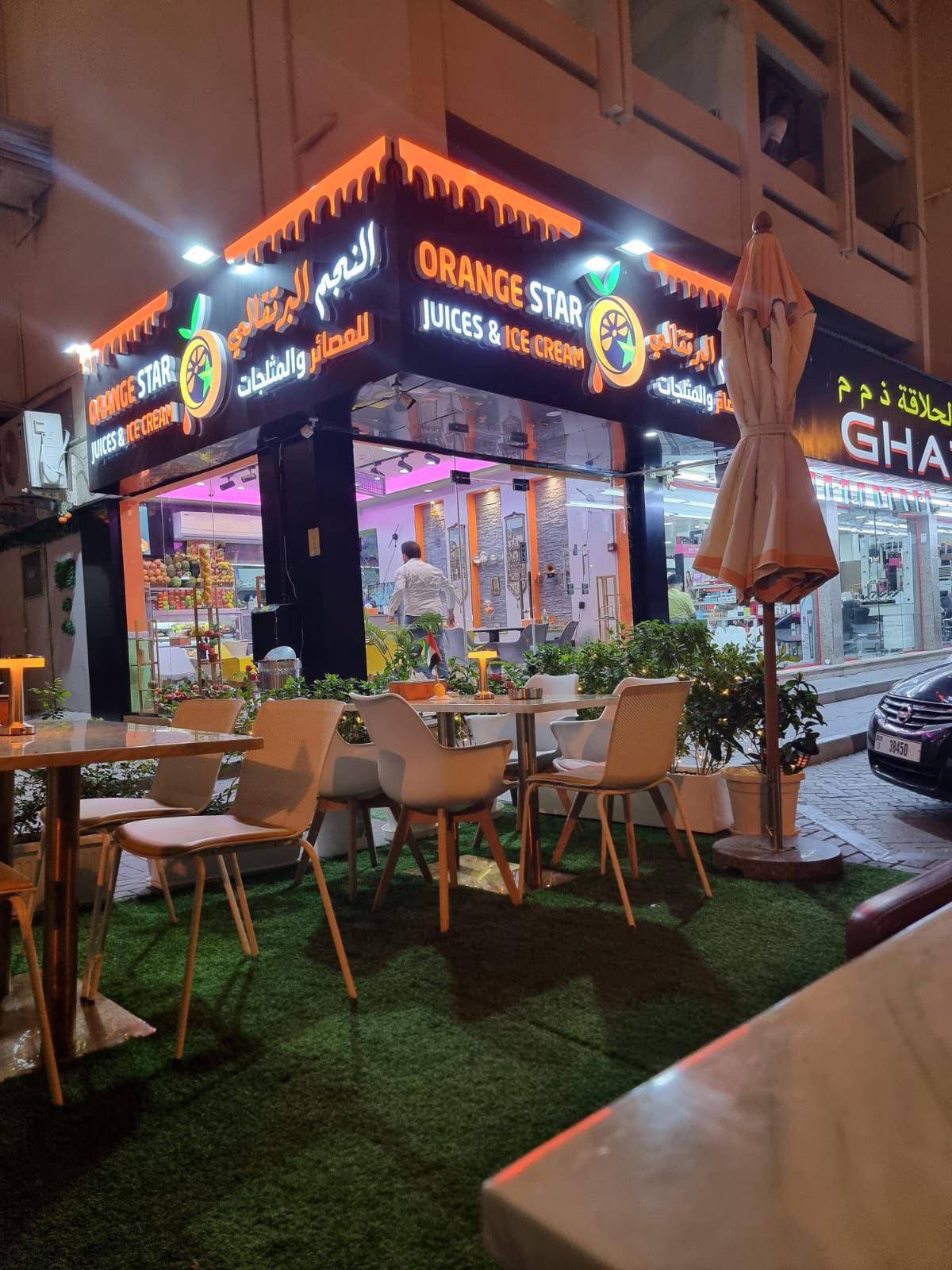 Orange Star Juice Shop Sharjah exterior night